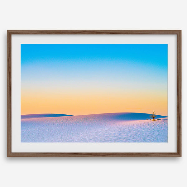 Panoramic desert landscape photography print showing White Sands National Park at sunset with blue sky and golden horizon.