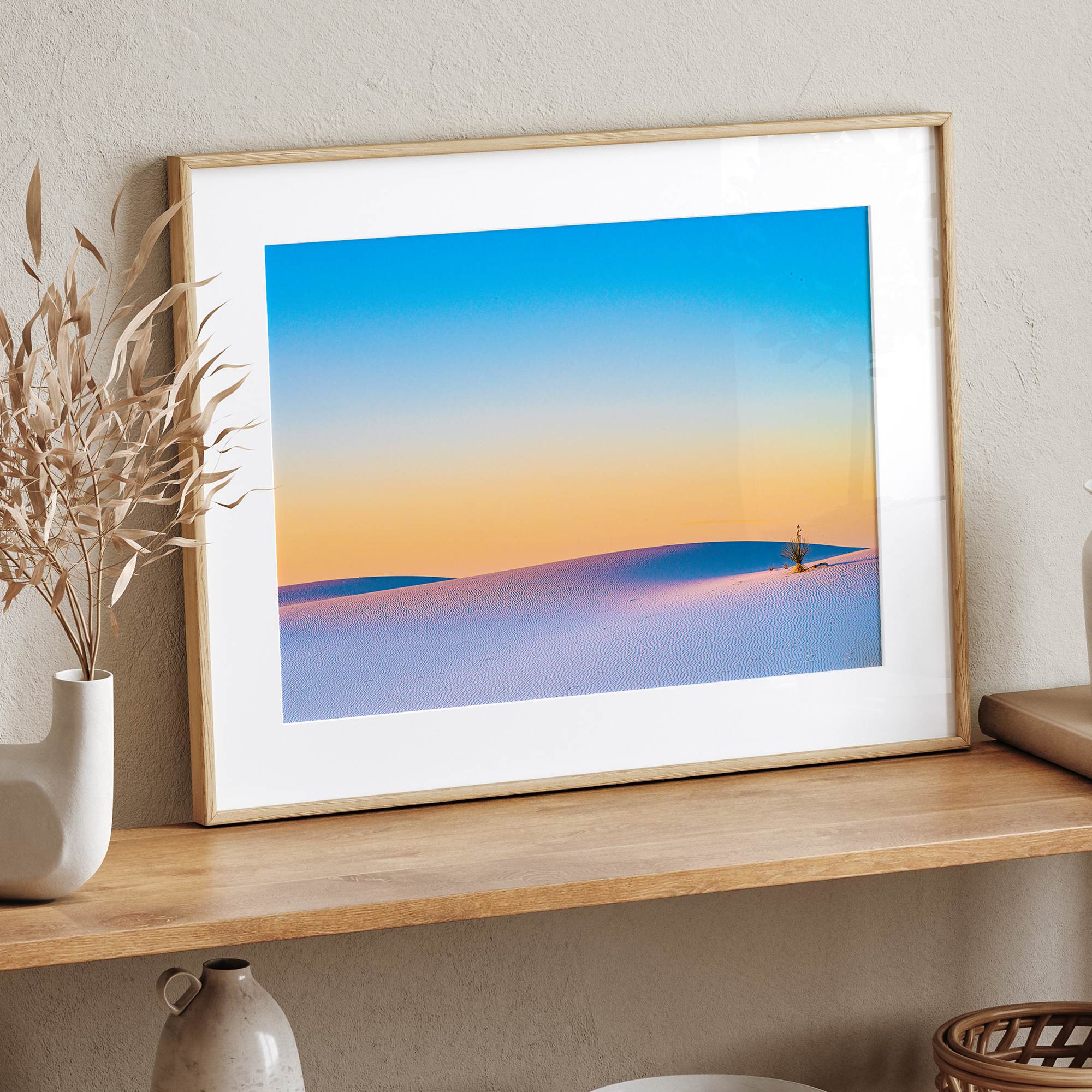 Panoramic desert landscape photography print showing White Sands National Park at sunset with blue sky and golden horizon.