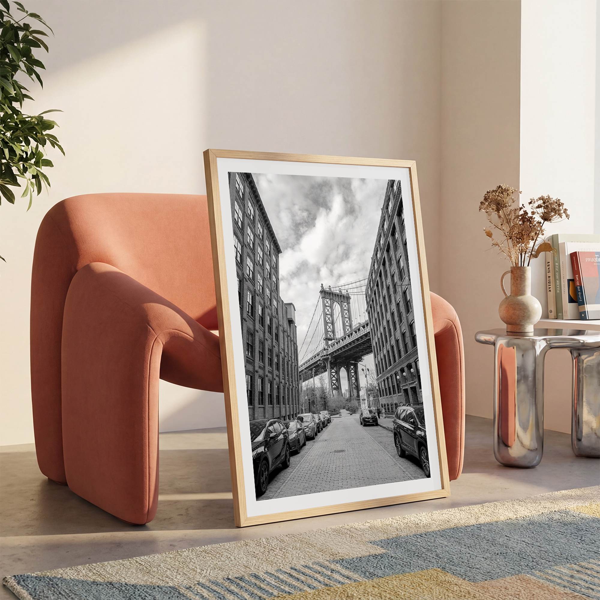 Framed Manhattan Bridge photography print in Dumbo Brooklyn with cobblestone street and monochrome architecture