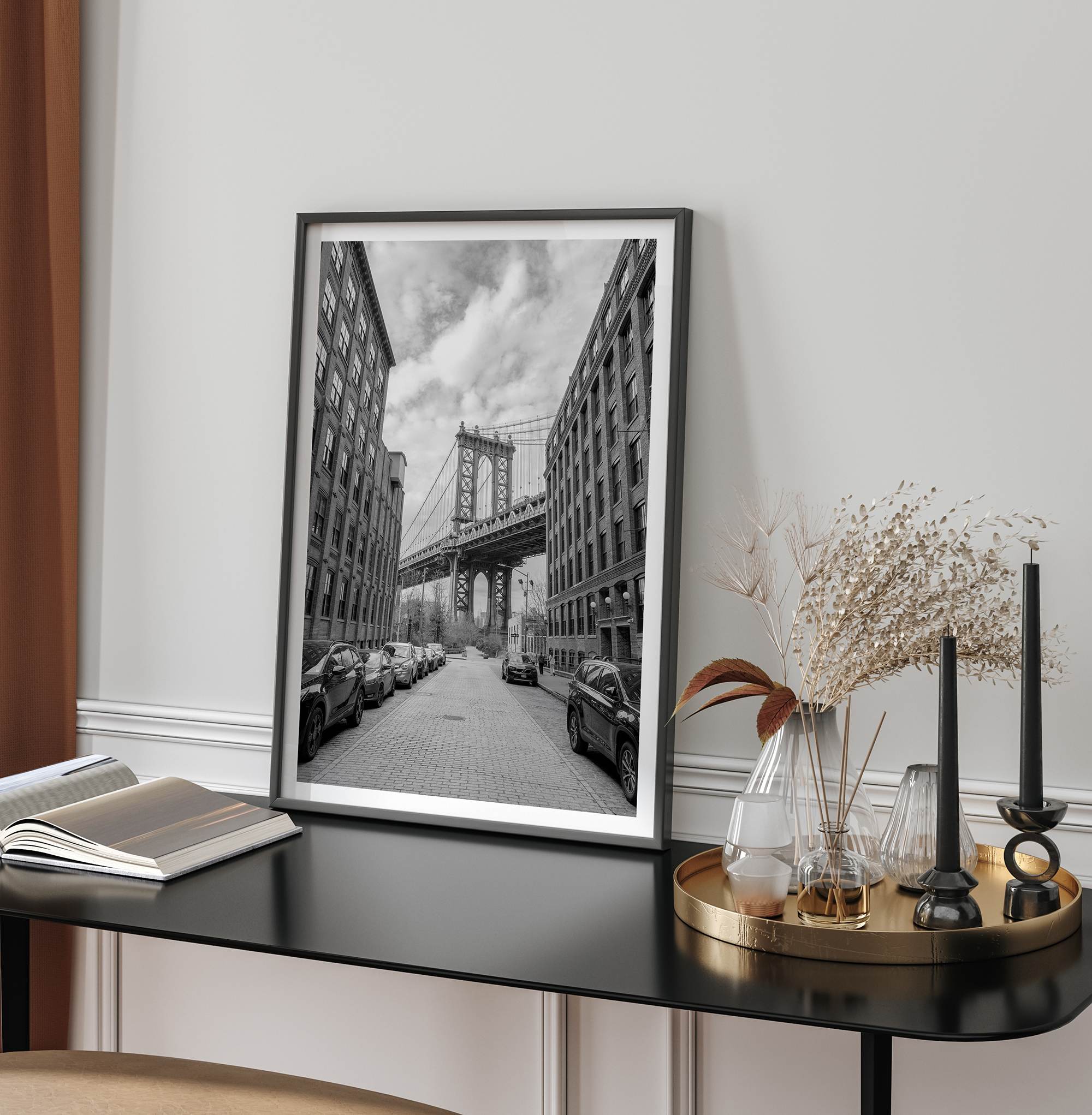 Framed Manhattan Bridge photography print in Dumbo Brooklyn with cobblestone street and monochrome architecture