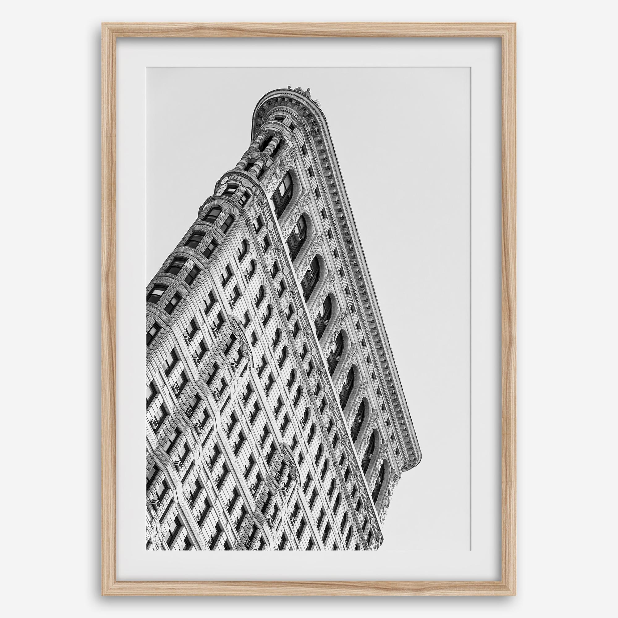Black and white Flatiron Building print showing the iconic New York City landmark from a dramatic upward perspective