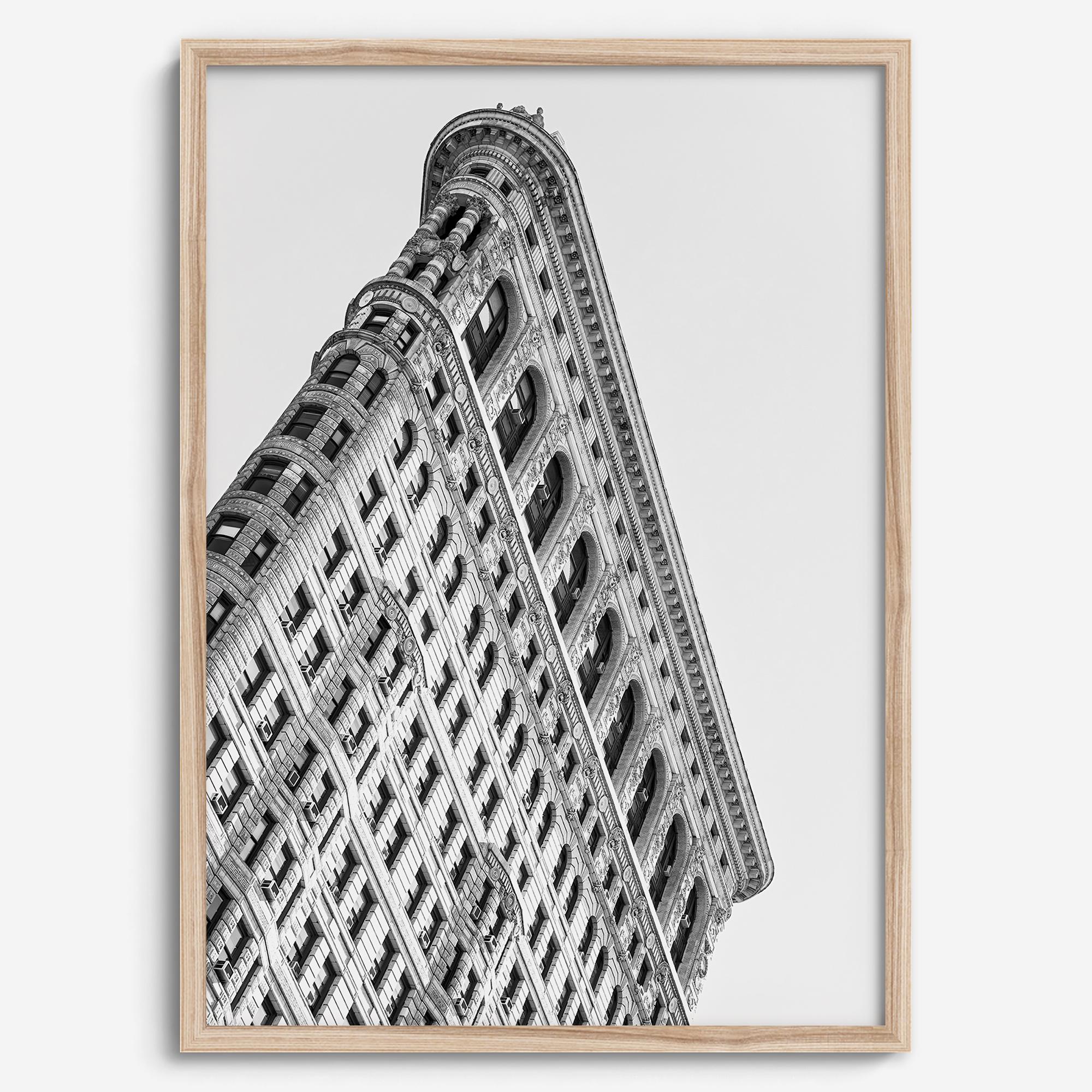 Black and white Flatiron Building print showing the iconic New York City landmark from a dramatic upward perspective