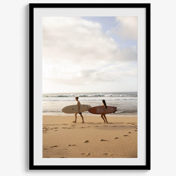 Framed surfers on beach art print featuring Hawaiian coastline and calm morning tones