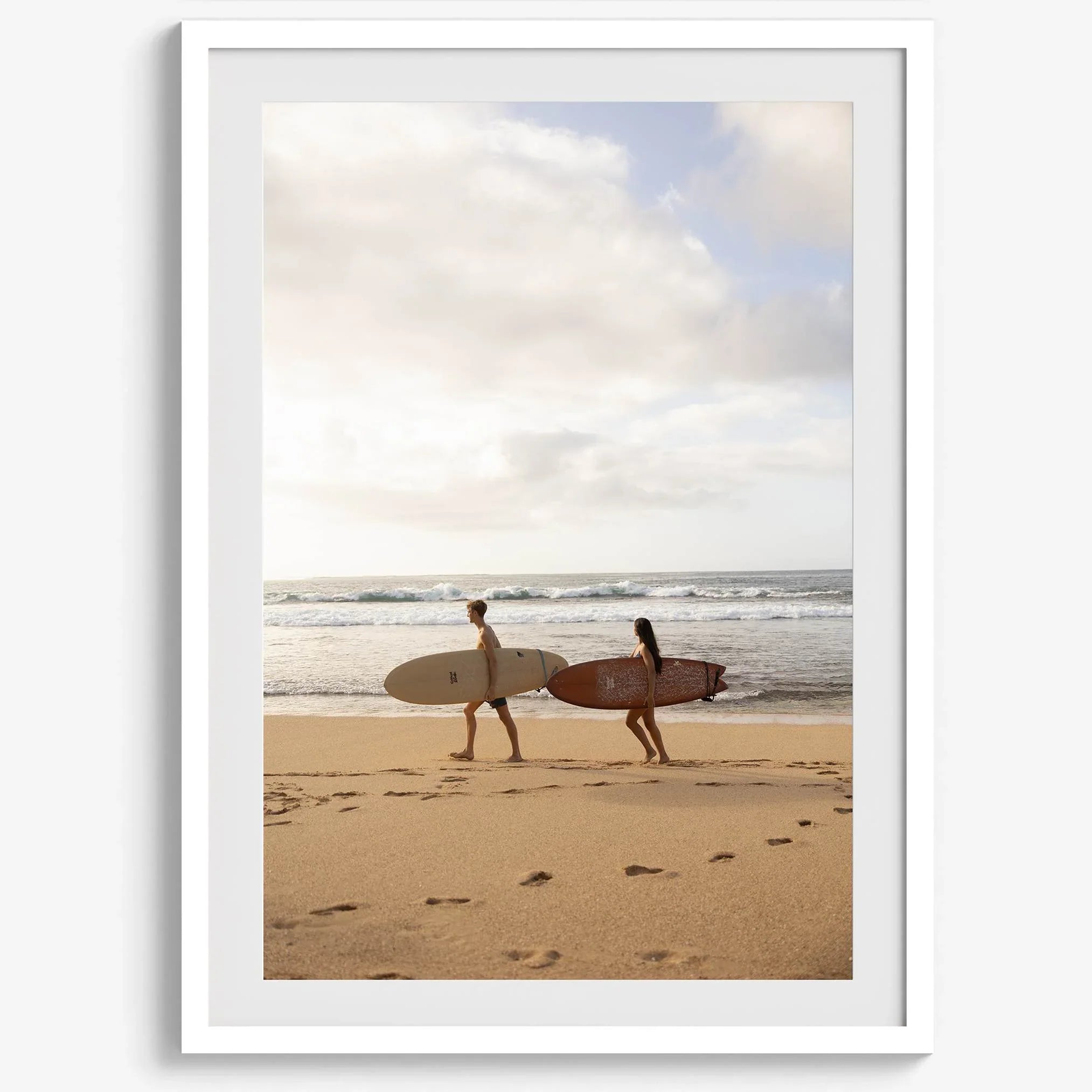 Framed surfers on beach art print featuring Hawaiian coastline and calm morning tones