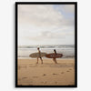 Framed surfers on beach art print featuring Hawaiian coastline and calm morning tones