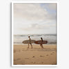 Framed surfers on beach art print featuring Hawaiian coastline and calm morning tones