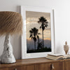 Palm tree wall art featuring two silhouetted palms at sunrise along a California beach.