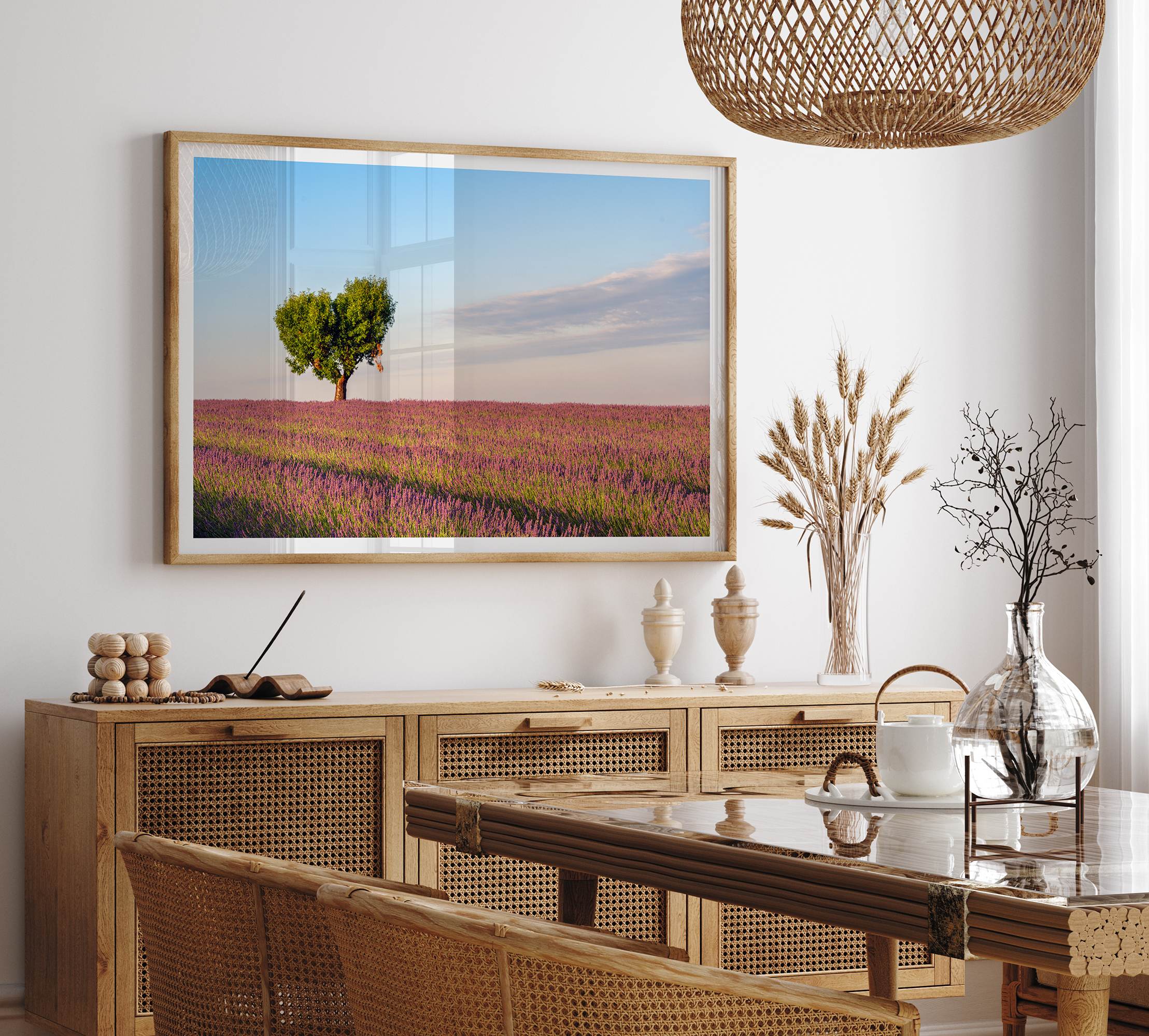 Fine art photograph of a heart shaped tree surrounded by lavender fields in Provence, France beneath a soft blue sky.