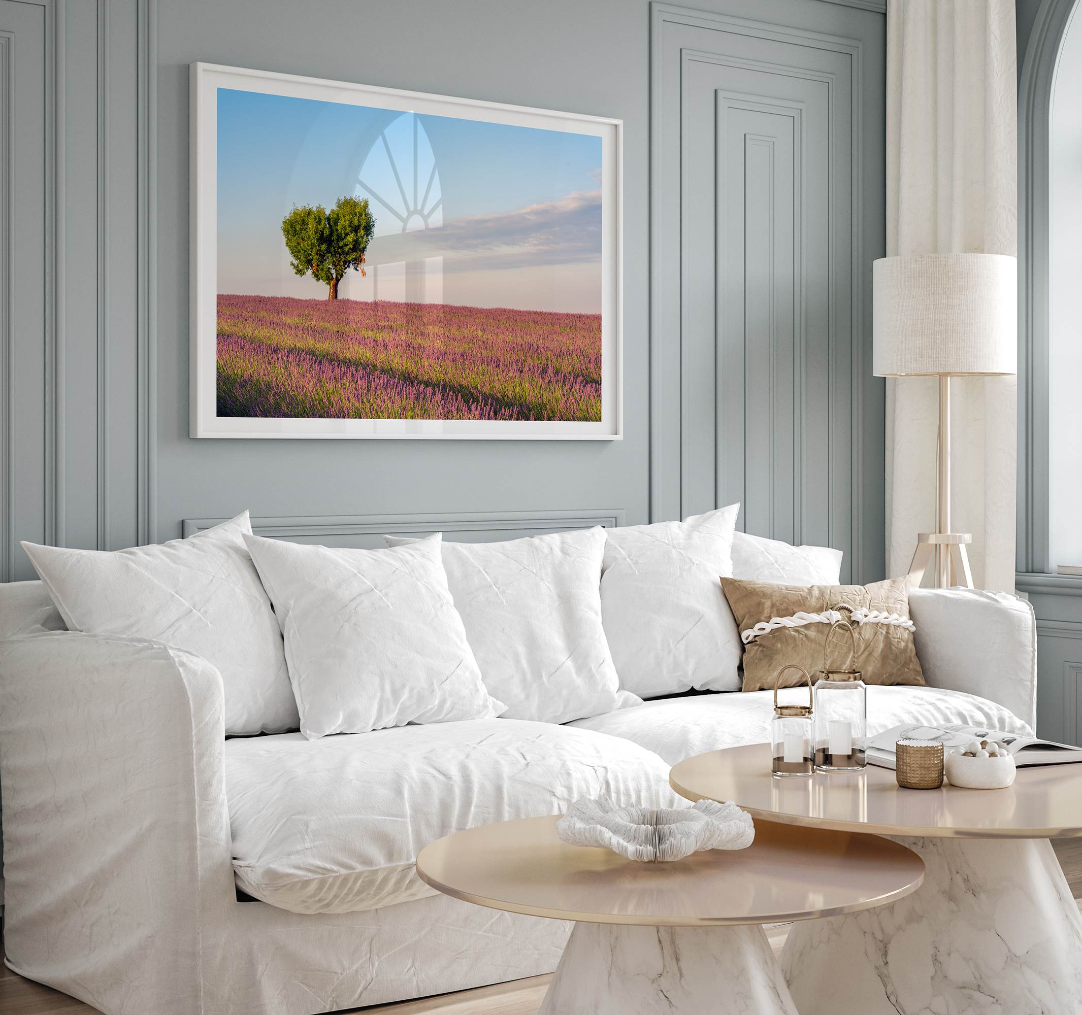 Fine art photograph of a heart shaped tree surrounded by lavender fields in Provence, France beneath a soft blue sky.