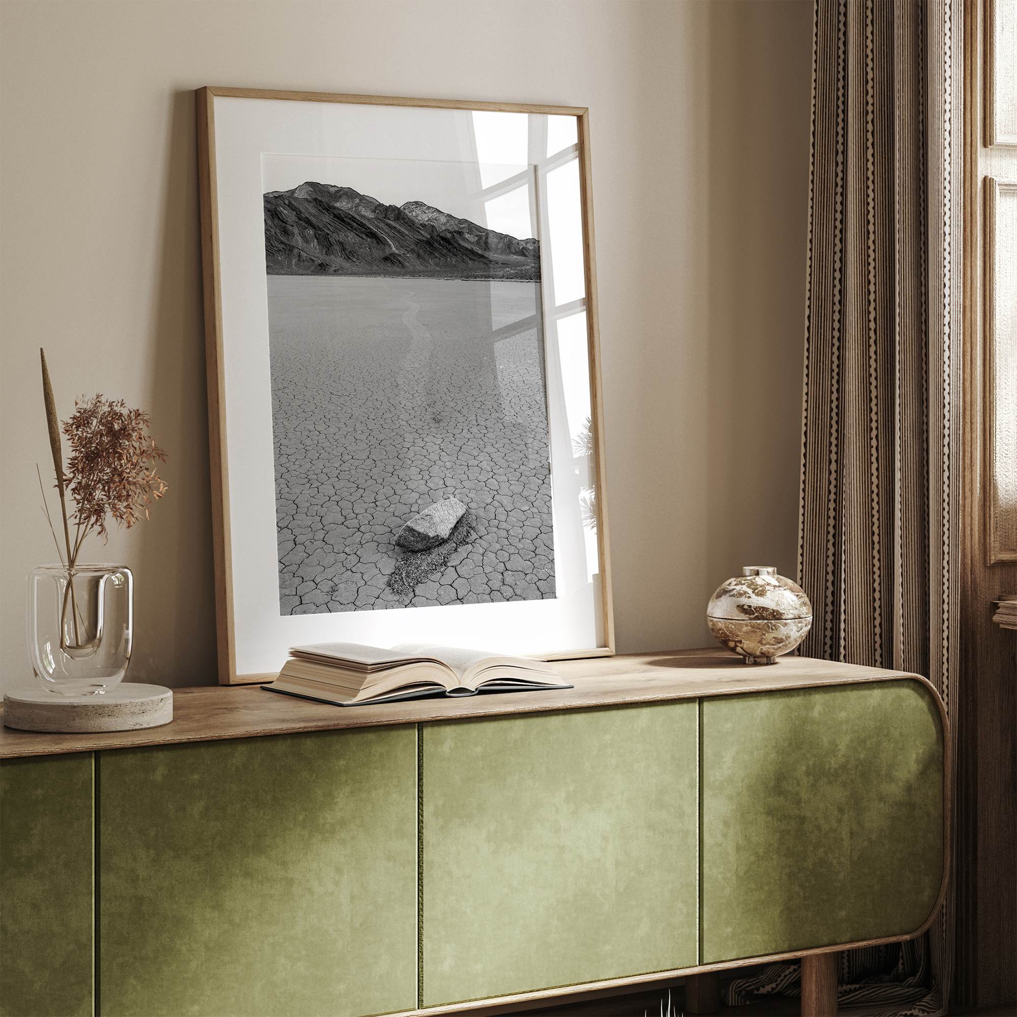 Fine art mojave print showing a sailing stone on Racetrack Playa in Death Valley with mountains in the background.