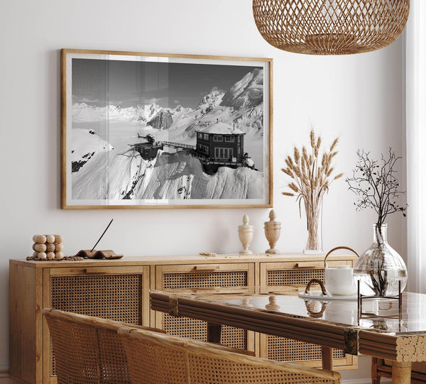 Black and white mountain cabin wall art with helicopter over snowy Denali peaks, Alaska winter landscape photography print.