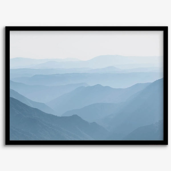 A fine art mountain photography print showing tens of shaded mountains one after the other. This minimalist mountain range wall art is perfect for nature lovers.