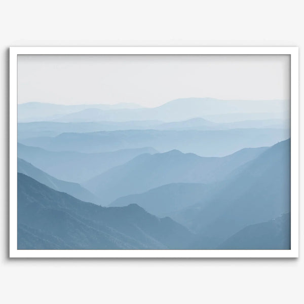 A fine art mountain photography print showing tens of shaded mountains one after the other. This minimalist mountain range wall art is perfect for nature lovers.