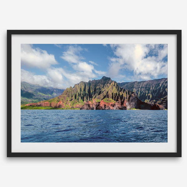 An extra large wall art showcasing the vertical green volcanic cliffs of Na Pali Coast Kauai meeting the blue Pacific Ocean.