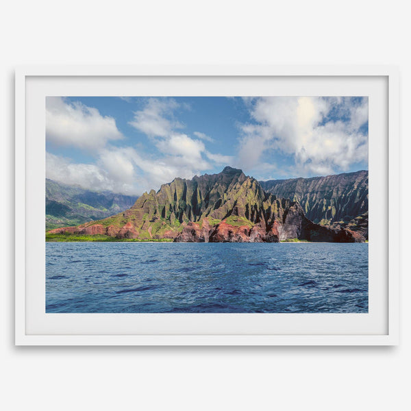 An extra large wall art showcasing the vertical green volcanic cliffs of Na Pali Coast Kauai meeting the blue Pacific Ocean.