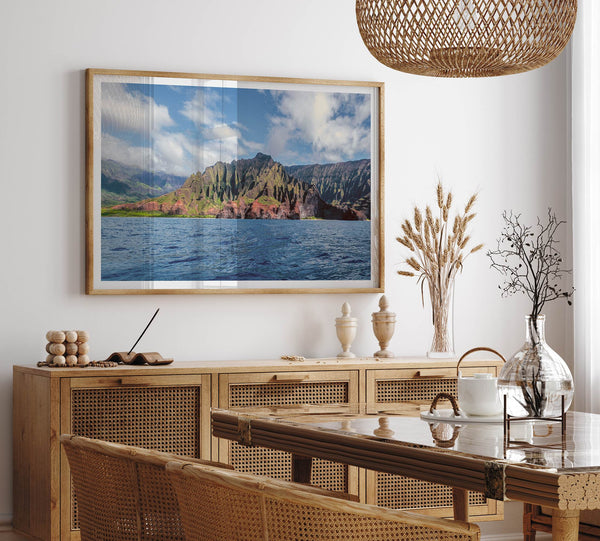 An extra large wall art showcasing the vertical green volcanic cliffs of Na Pali Coast Kauai meeting the blue Pacific Ocean.