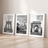 Framed New York photography set with Brooklyn Bridge, Chrysler Building skyline, and Washington Square Park scenes.