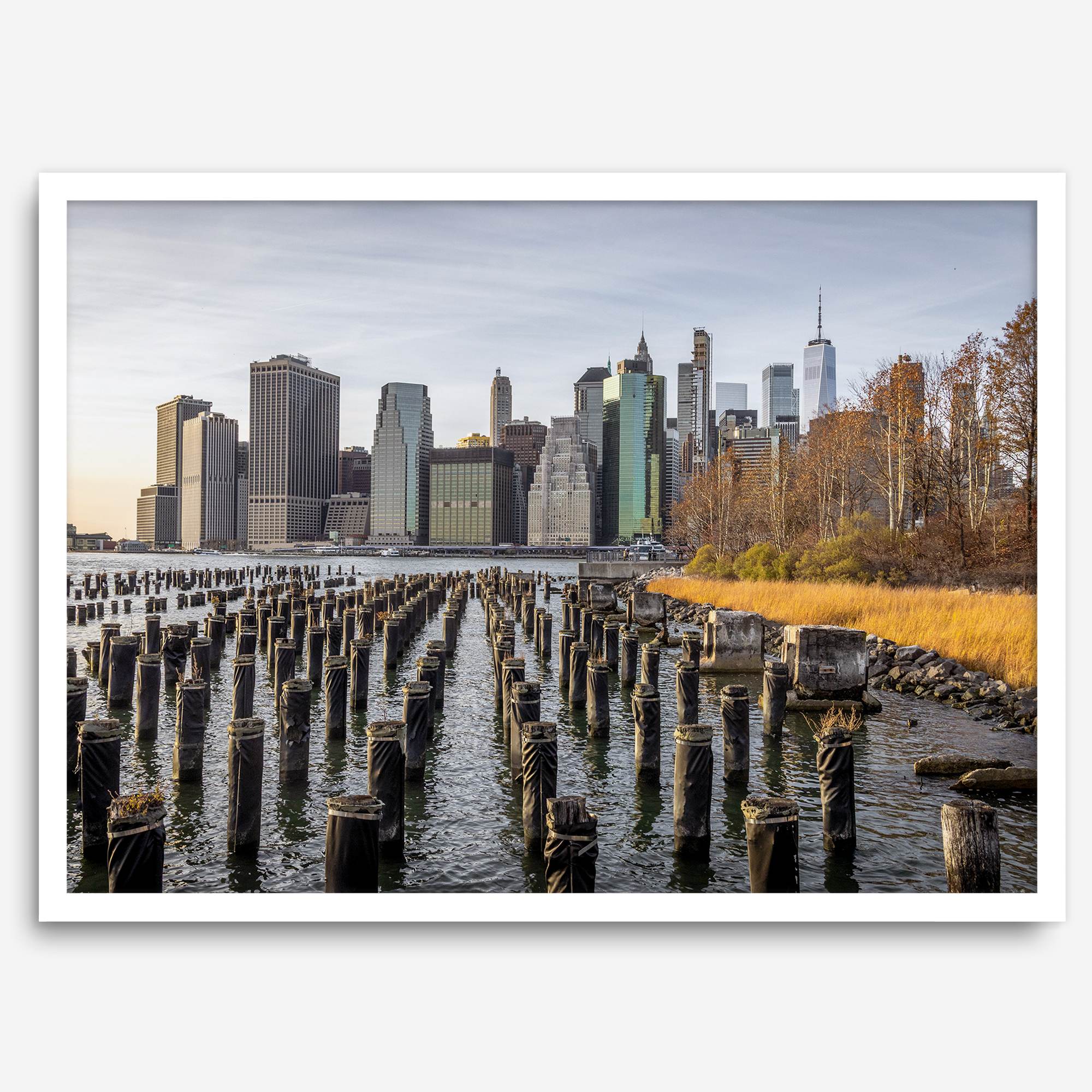Urban landscape photography of Lower Manhattan from Brooklyn Bridge Park waterfront.