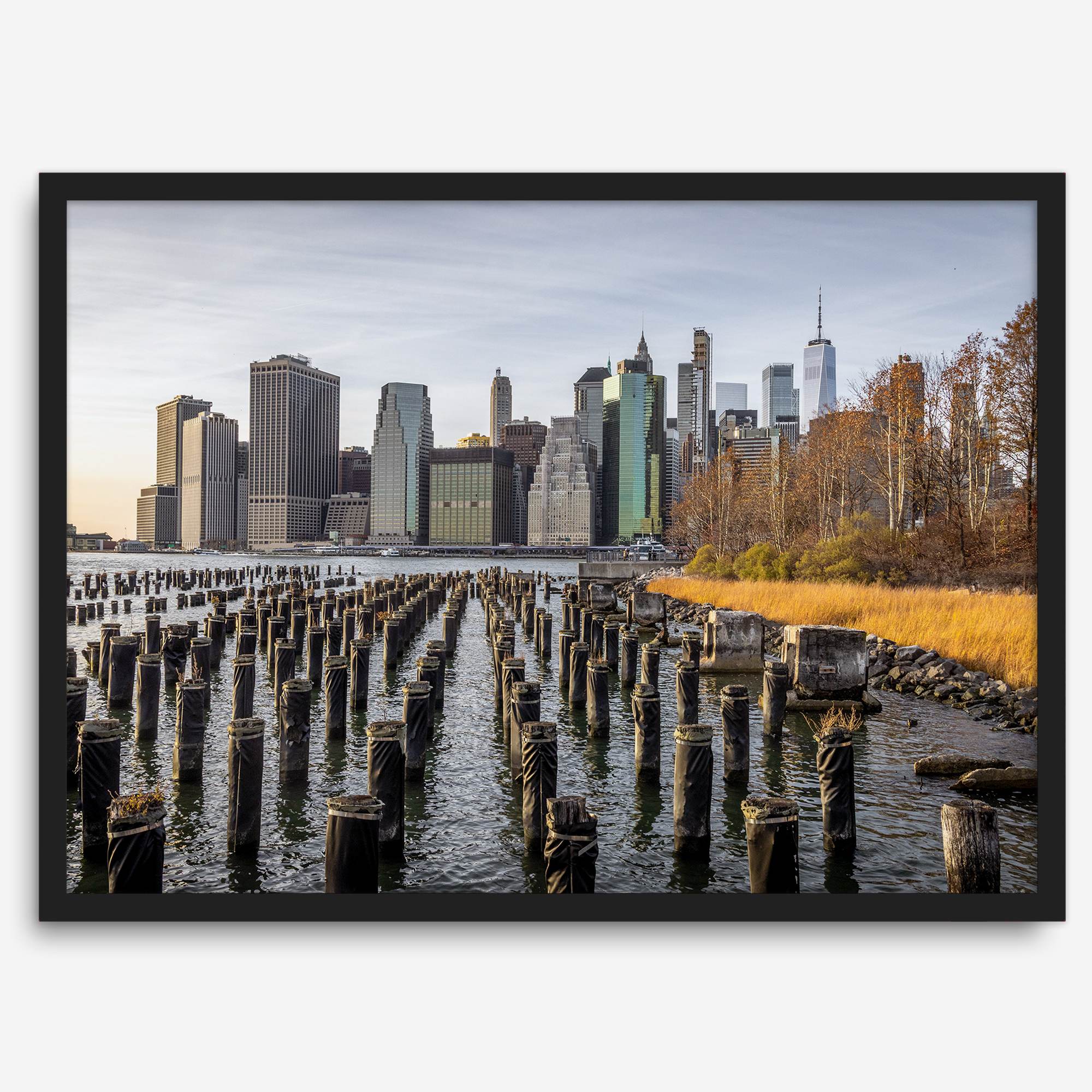 Urban landscape photography of Lower Manhattan from Brooklyn Bridge Park waterfront.