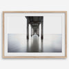 La Jolla coastal photograph looking beneath Scripps Pier toward the Pacific horizon, featuring symmetrical columns and minimalist ocean tones.