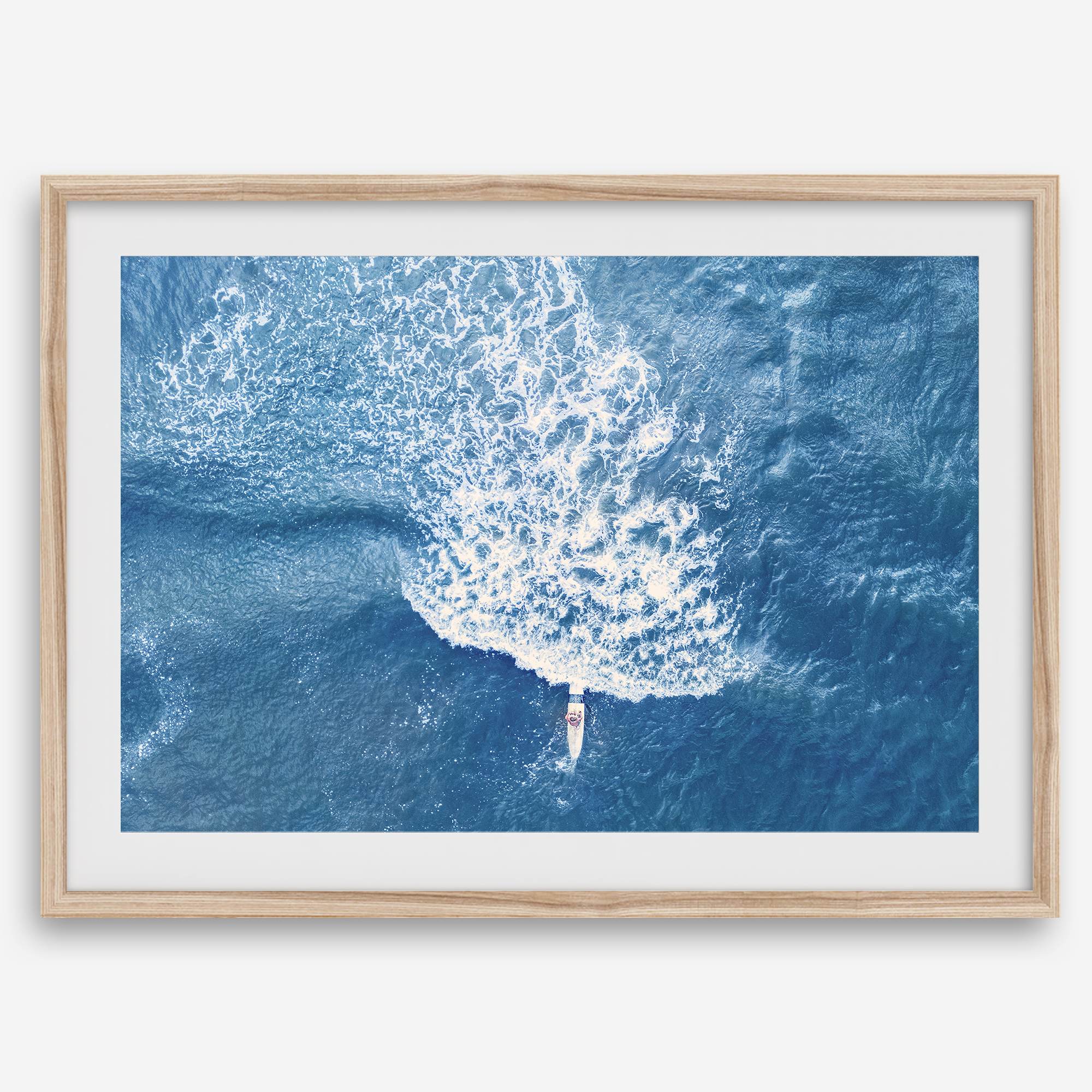 Ocean wave aerial photography print featuring a surfer in Kauai Hawaii with modern coastal styling