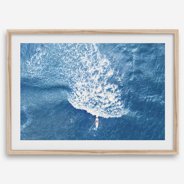 Ocean wave aerial photography print featuring a surfer in Kauai Hawaii with modern coastal styling