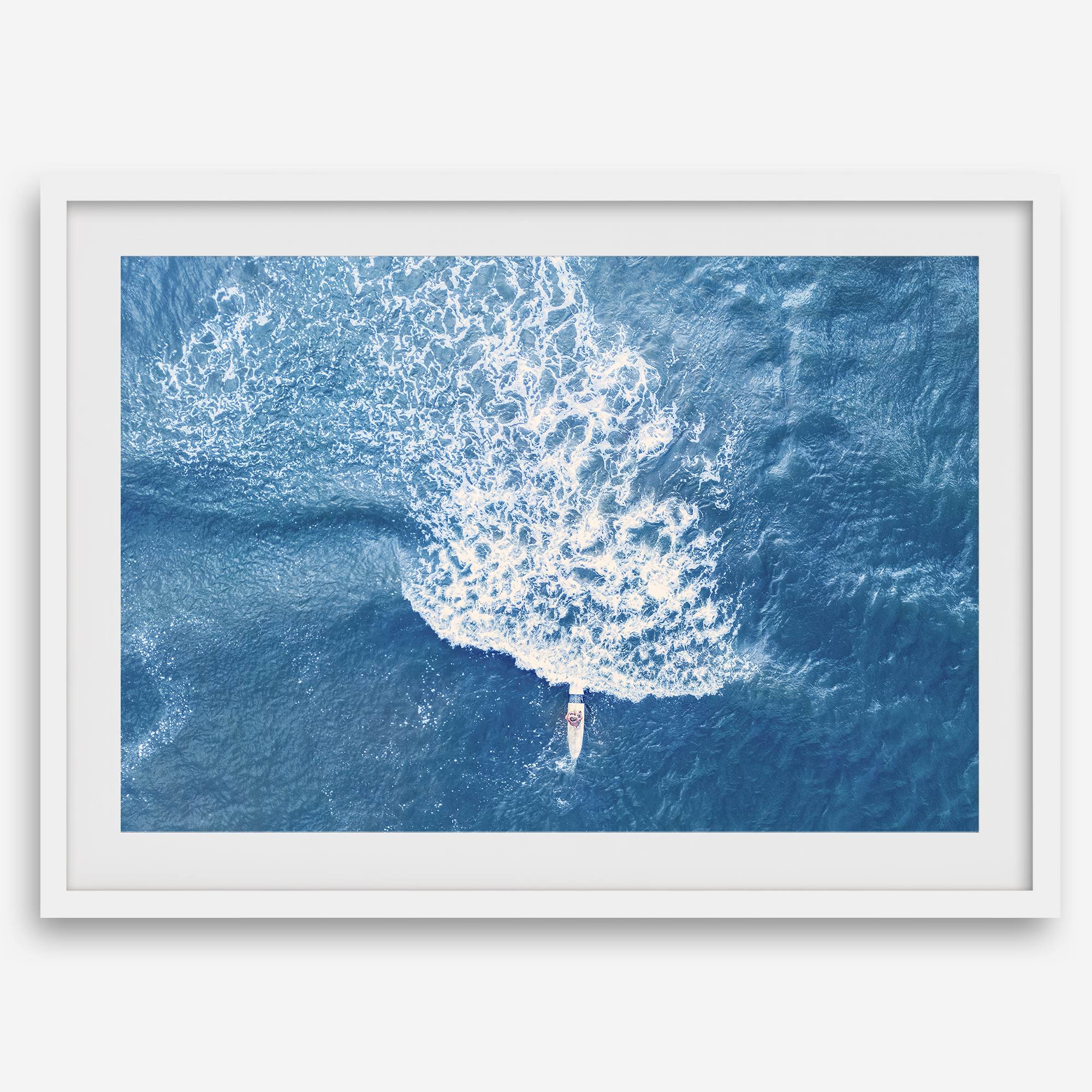 Ocean wave aerial photography print featuring a surfer in Kauai Hawaii with modern coastal styling