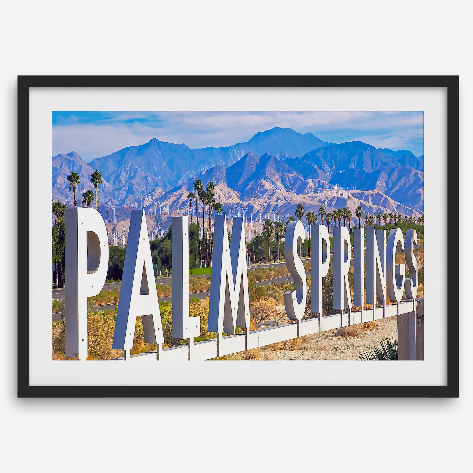 Panoramic Palm Springs sign artwork featuring palm trees and mountain views in California