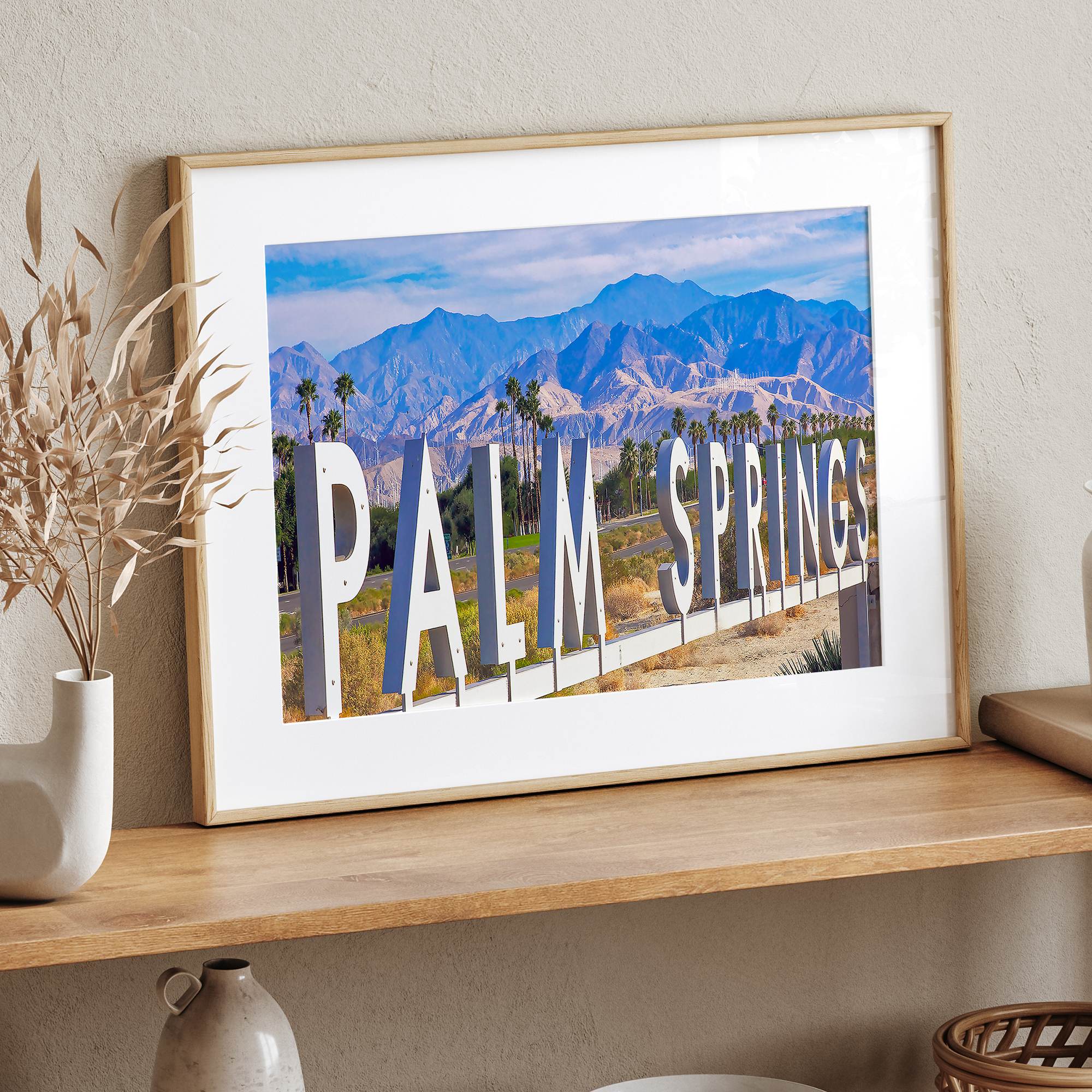 Panoramic Palm Springs sign artwork featuring palm trees and mountain views in California