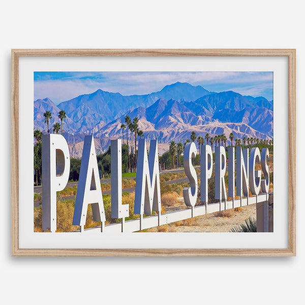 Panoramic Palm Springs sign artwork featuring palm trees and mountain views in California