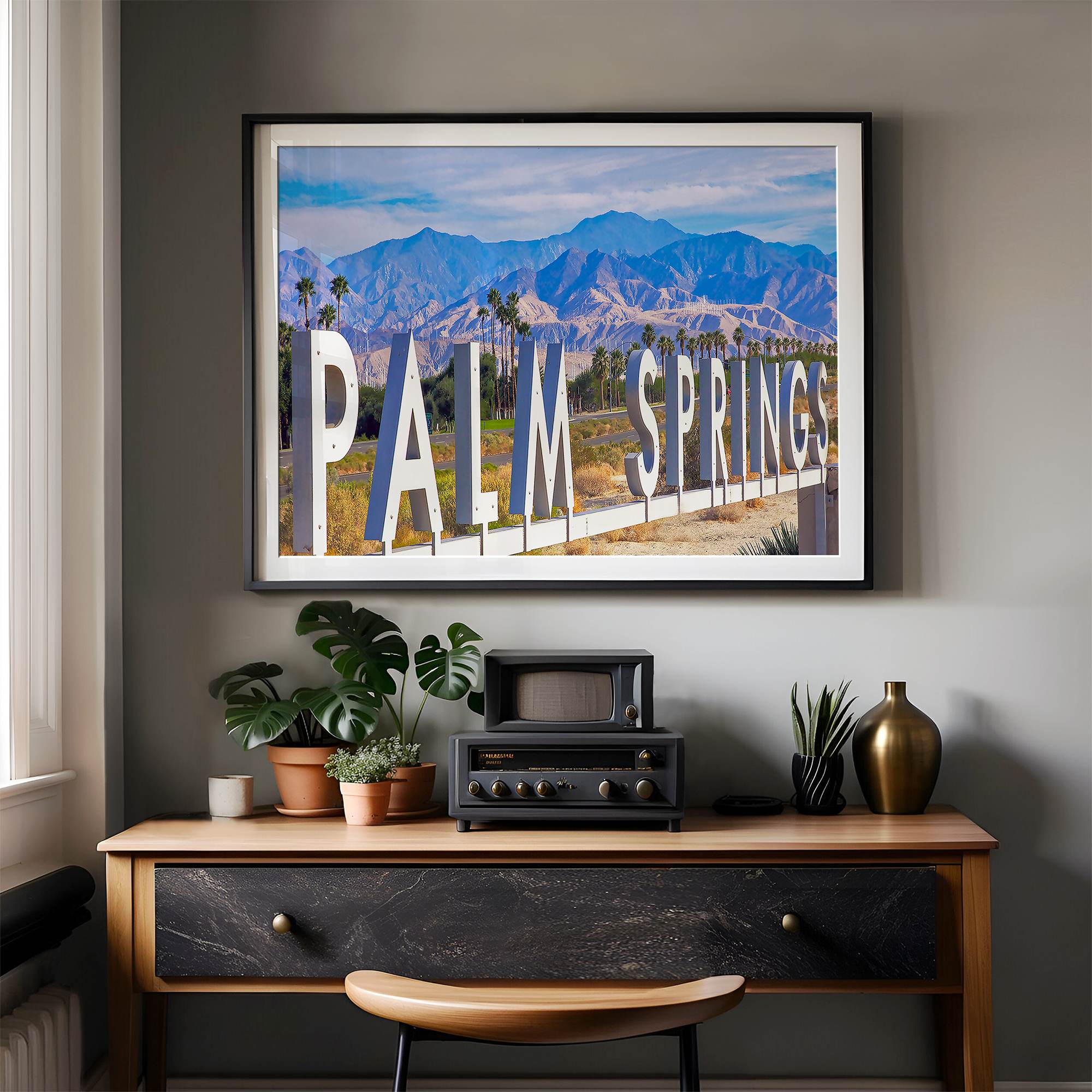 Panoramic Palm Springs sign artwork featuring palm trees and mountain views in California