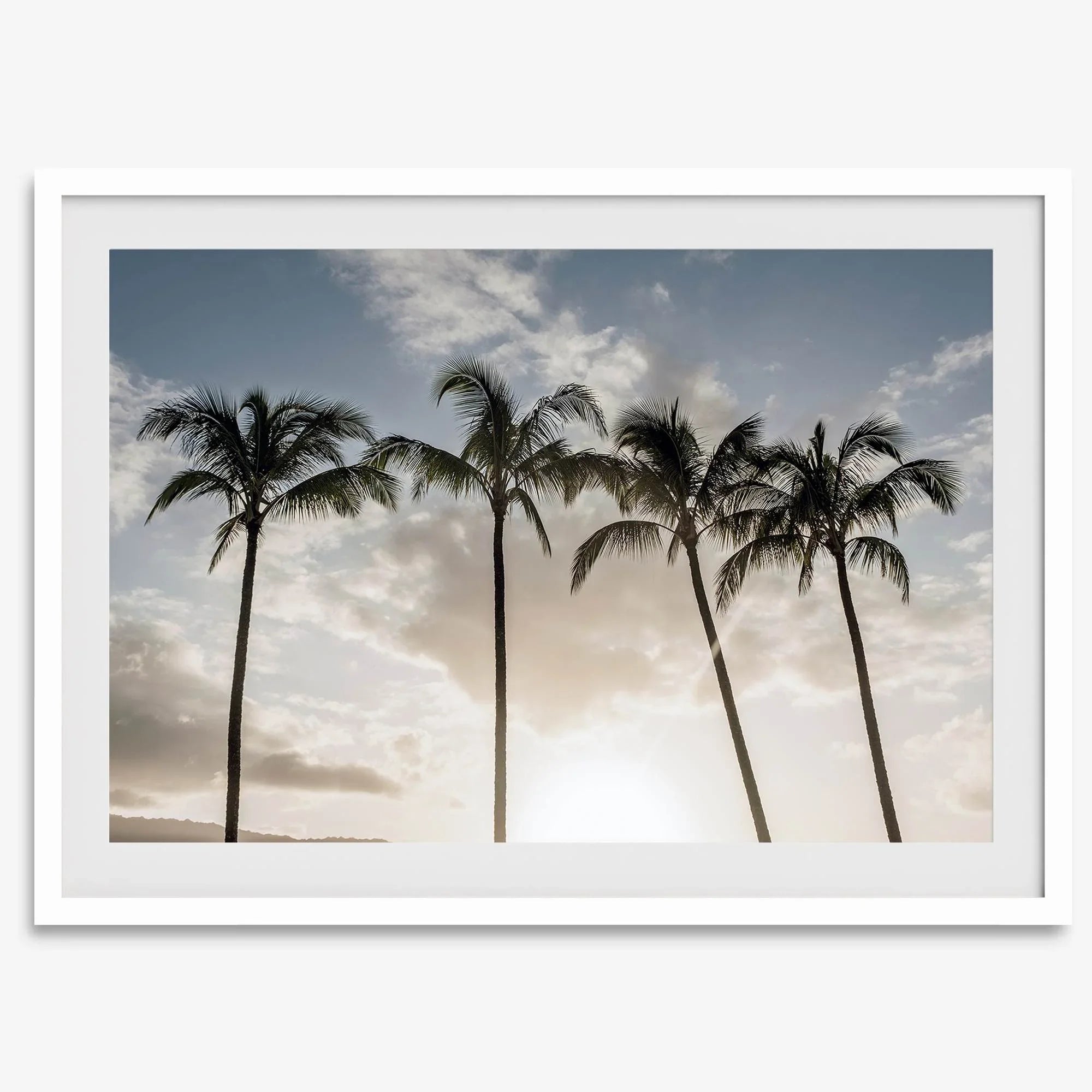 Sunset over palm trees in Kauai with golden sky and tropical landscape for wall decor