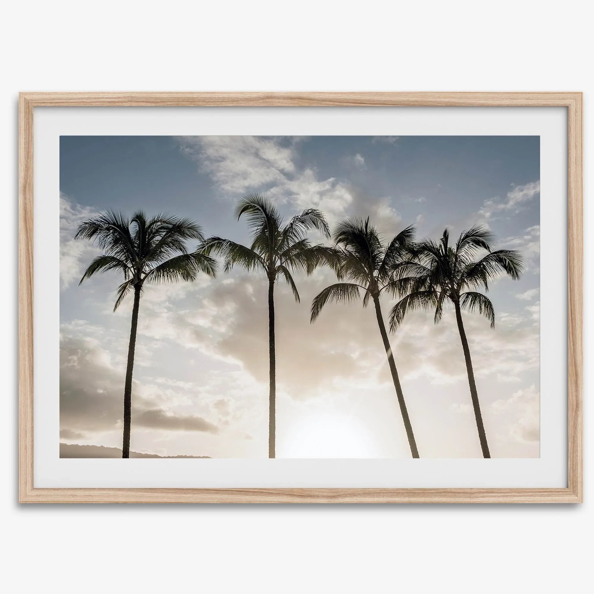 Sunset over palm trees in Kauai with golden sky and tropical landscape for wall decor