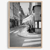 Paris street photography showing glowing café at dusk on Rue de l’Université in black and white.