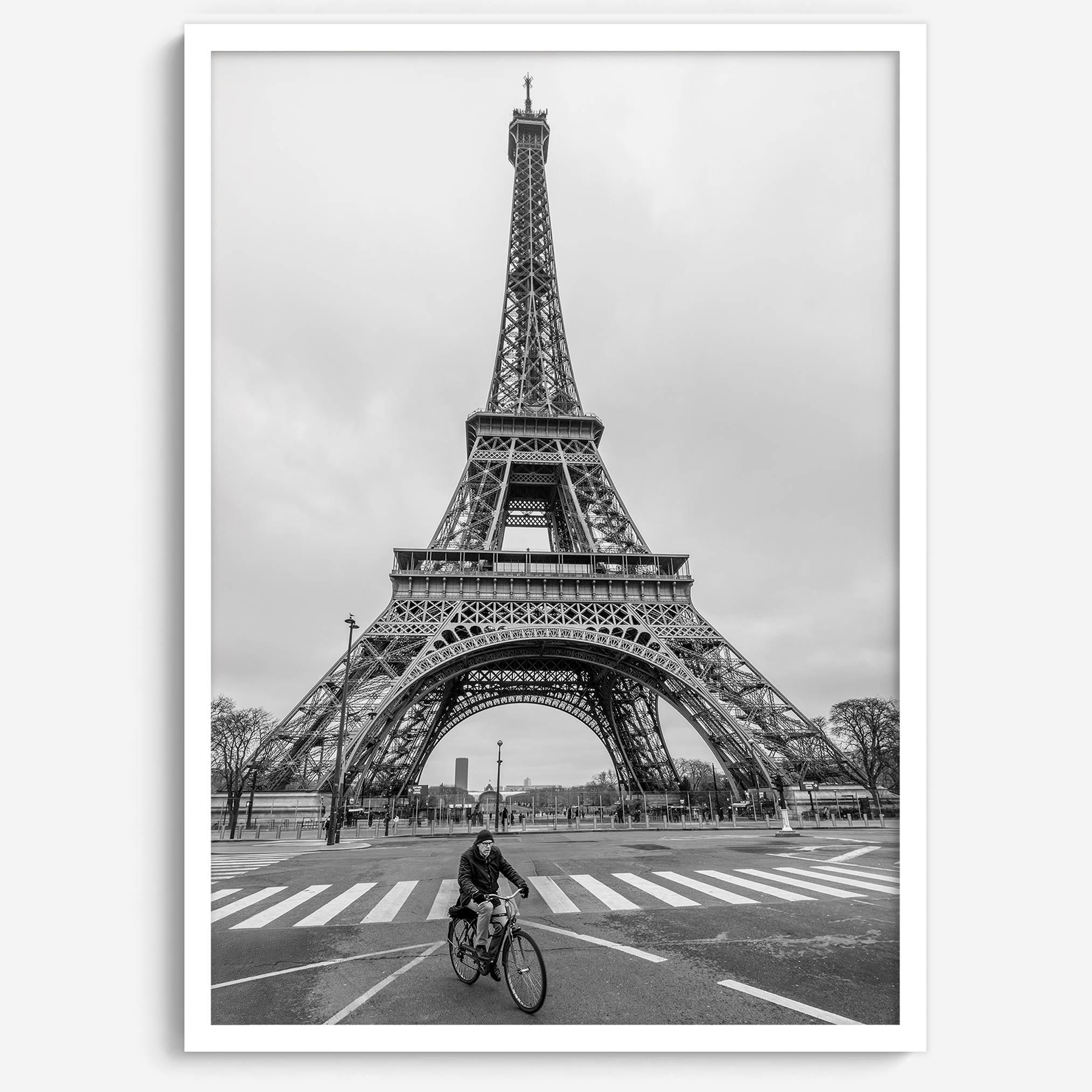 Black-and-white Eiffel Tower photo with a cyclist in the foreground, perfect for Paris wall art decor.