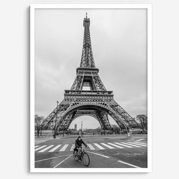 Black-and-white Eiffel Tower photo with a cyclist in the foreground, perfect for Paris wall art decor.