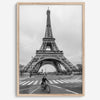 Black-and-white Eiffel Tower photo with a cyclist in the foreground, perfect for Paris wall art decor.