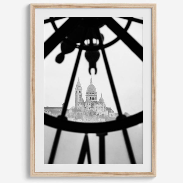 Black-and-white Paris wall decor showcasing the Sacré-Coeur Basilica framed by the Musée d’Orsay clock.