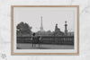 Black-and-white Paris wall art featuring a woman reading in a park with the Eiffel Tower in the background.