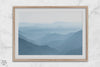 A fine art mountain photography print showing tens of shaded mountains one after the other. This minimalist mountain range wall art is perfect for nature lovers.
