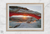 Canyonlands wall art featuring Mesa Arch at sunrise, with sunlight shining through the snow-covered arch over a vast canyon landscape.