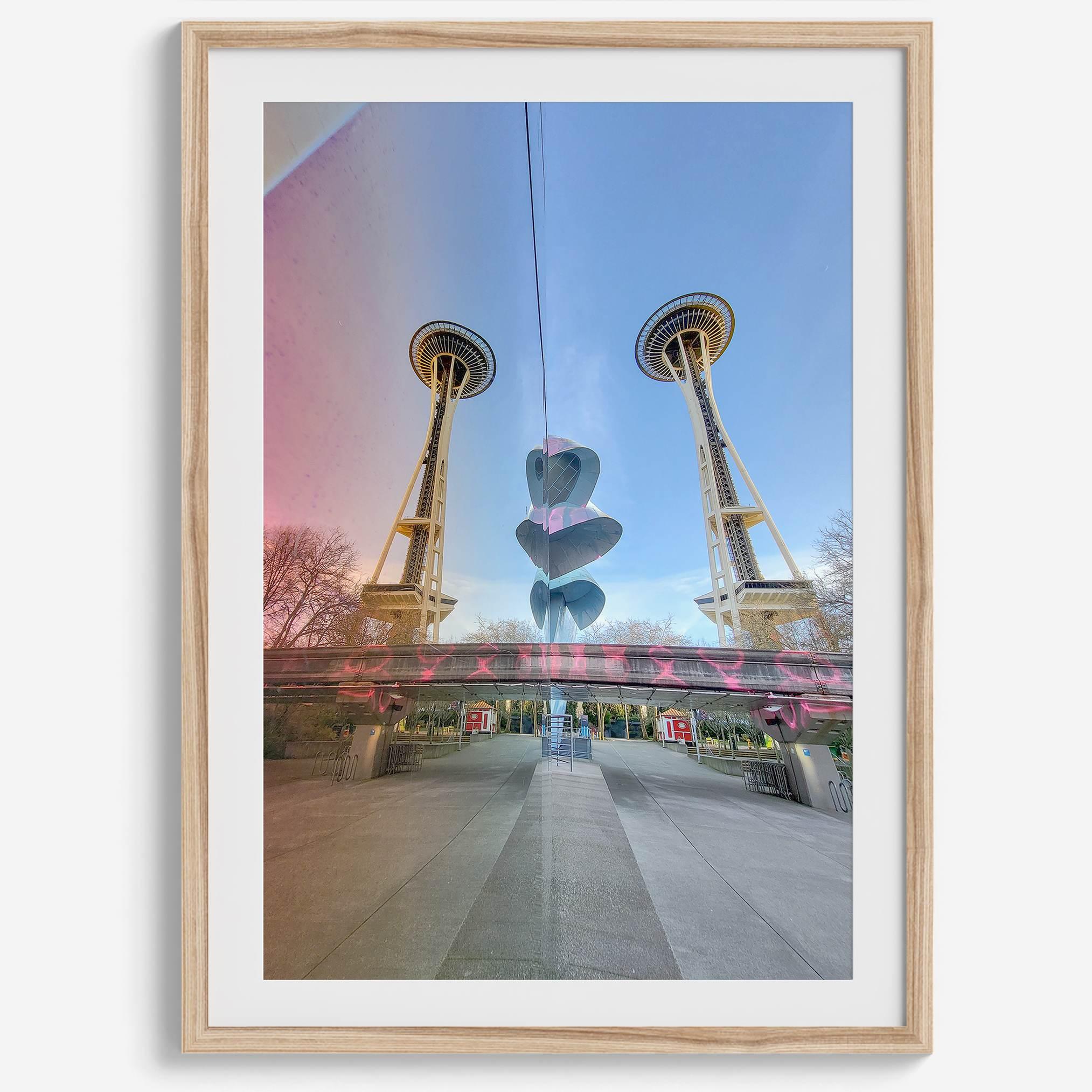 Seattle wall art featuring Space Needle reflected on Museum of Pop Culture walls with pink and blue tones.