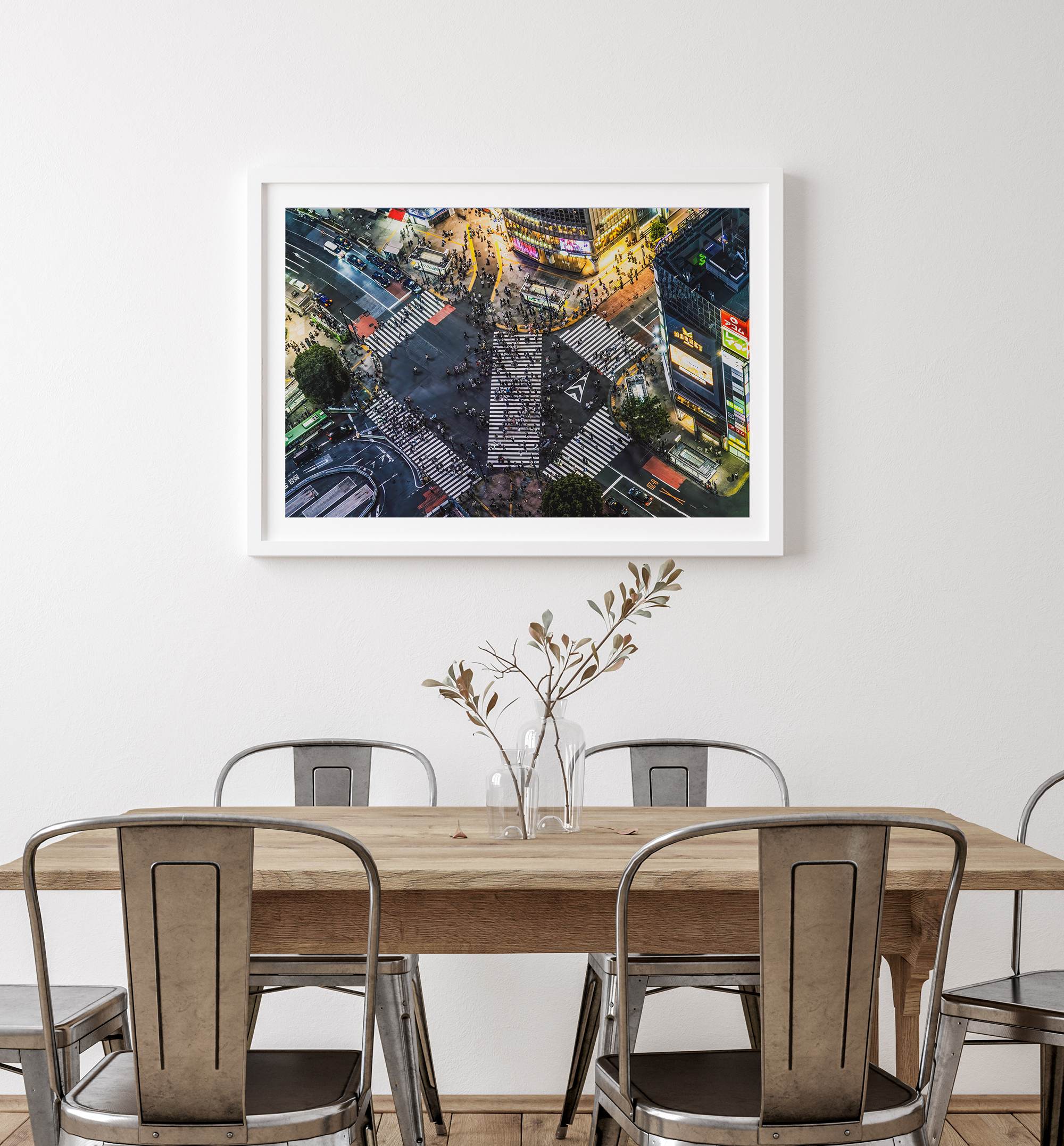 Shibuya Crossing print featuring an aerial Tokyo night scene with illuminated crosswalks and vibrant urban movement.