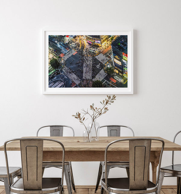 Shibuya Crossing print featuring an aerial Tokyo night scene with illuminated crosswalks and vibrant urban movement.