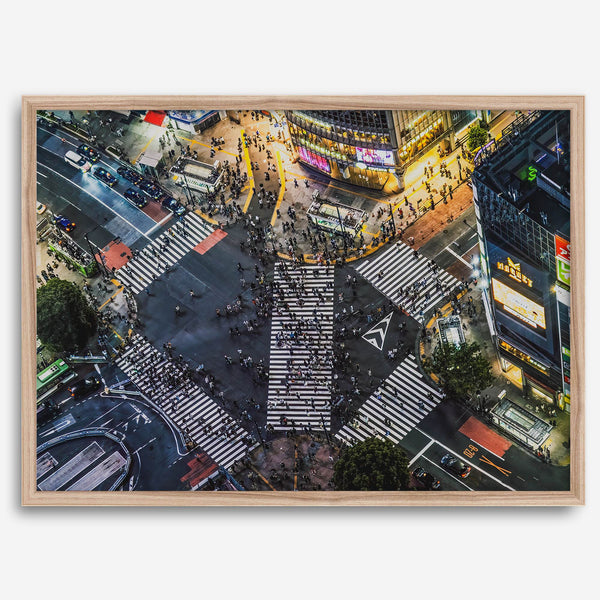 Shibuya Crossing print featuring an aerial Tokyo night scene with illuminated crosswalks and vibrant urban movement.