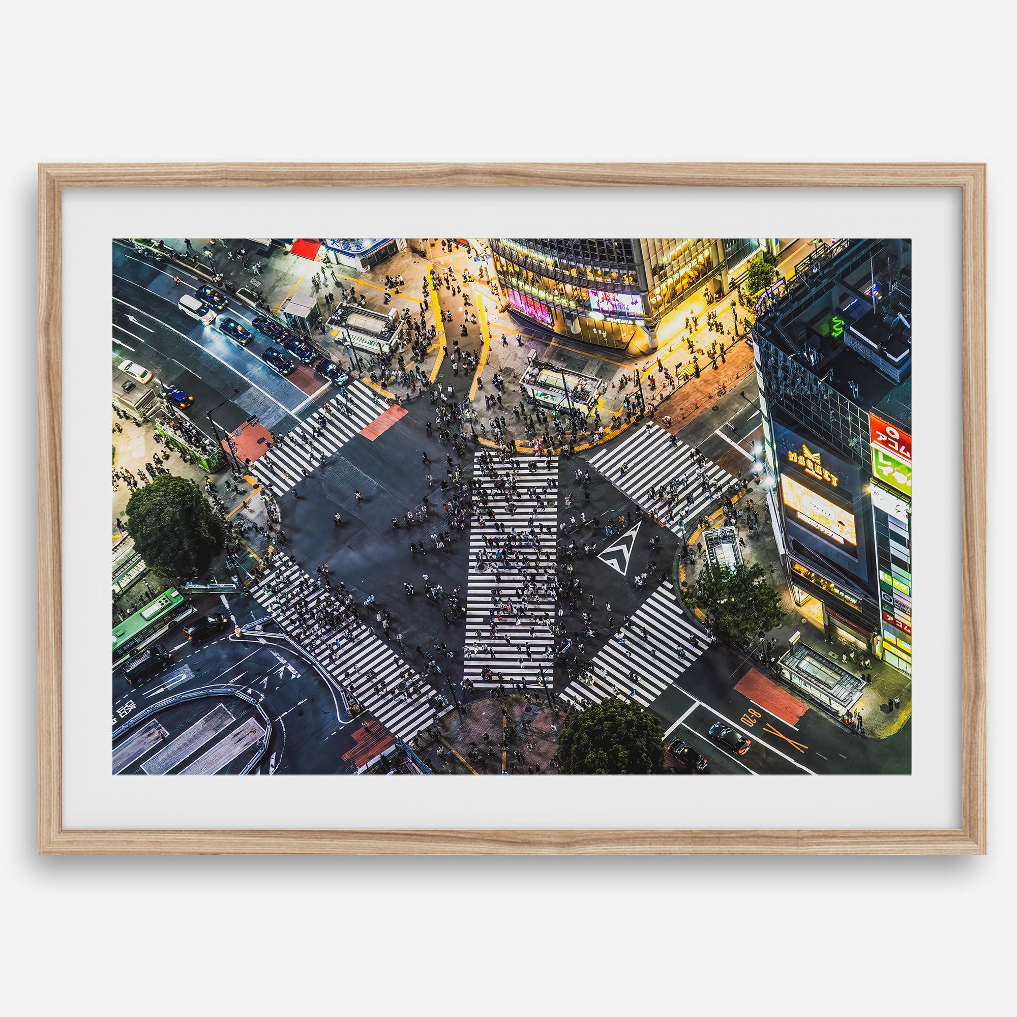 Shibuya Crossing print featuring an aerial Tokyo night scene with illuminated crosswalks and vibrant urban movement.