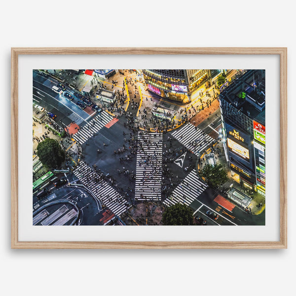 Shibuya Crossing print featuring an aerial Tokyo night scene with illuminated crosswalks and vibrant urban movement.
