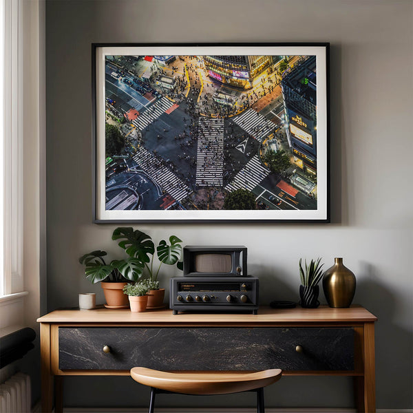 Shibuya Crossing print featuring an aerial Tokyo night scene with illuminated crosswalks and vibrant urban movement.