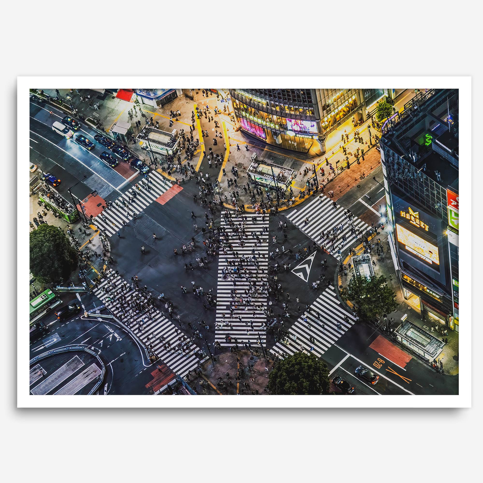 Shibuya Crossing print featuring an aerial Tokyo night scene with illuminated crosswalks and vibrant urban movement.