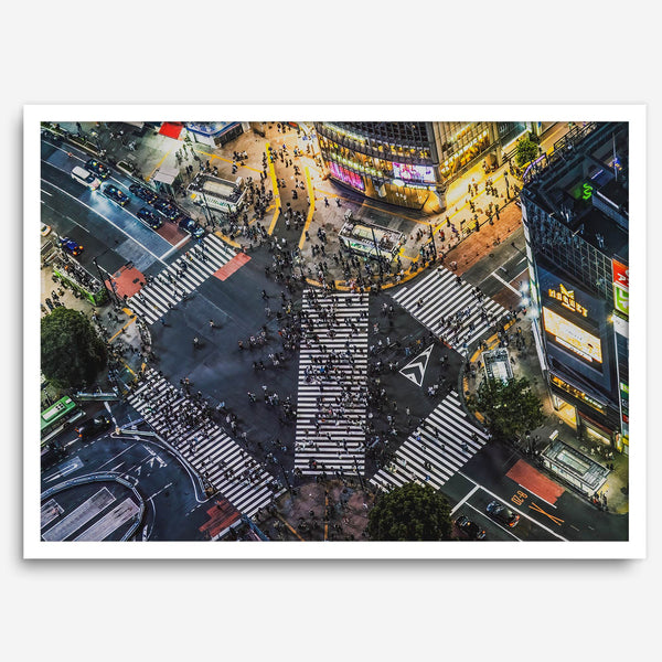Shibuya Crossing print featuring an aerial Tokyo night scene with illuminated crosswalks and vibrant urban movement.